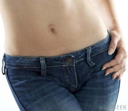 close-view-of-persons-stomach-and-lower-body-in-jeans